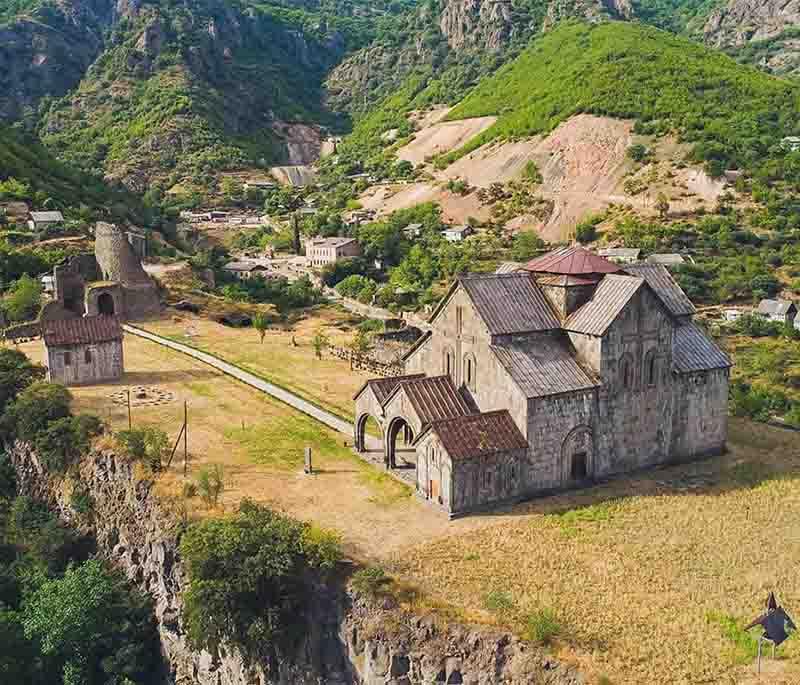 Akhtala Monastery, presenting a fortified monastery known for its well-preserved frescoes and commanding hilltop location.