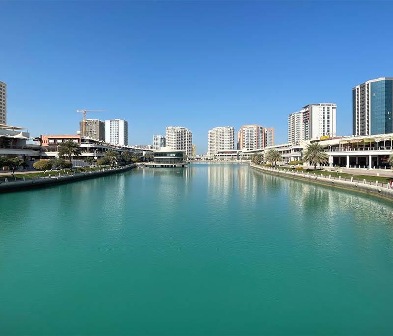 Al Naim Lagoon, depicting a serene lagoon area with natural beauty, recreational opportunities, and scenic views.