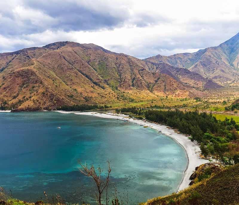 Anawangin Cove - A scenic beach with unique pine-like trees growing on volcanic ash, popular for camping and hiking.