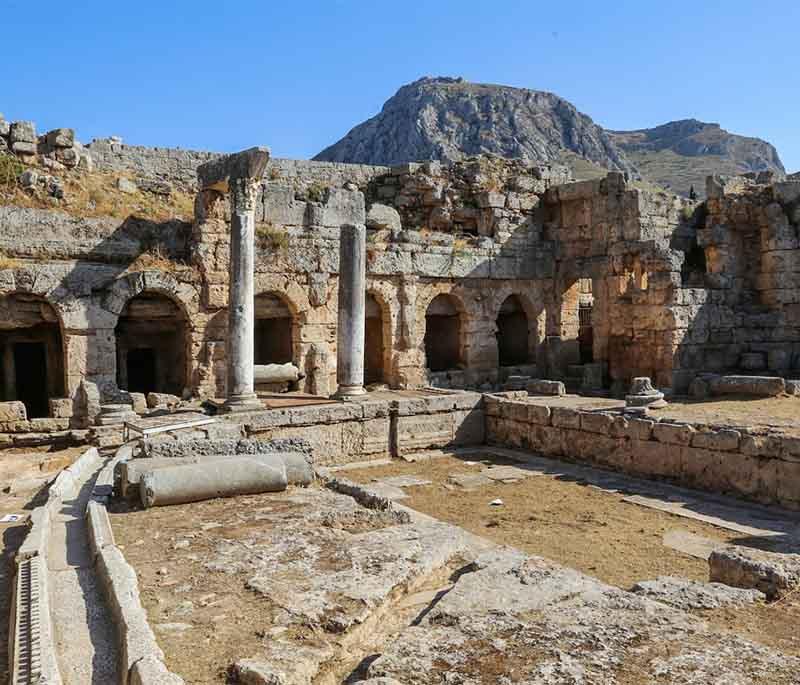 Ancient Corinth, an important city-state in ancient Greece, featuring extensive ruins, including the Temple of Apollo.