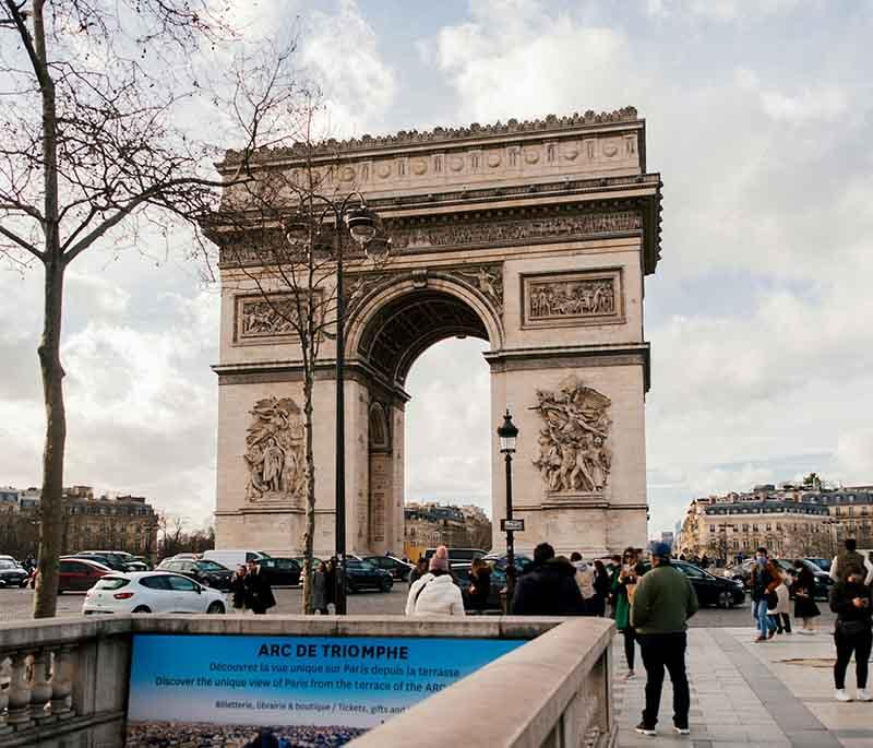 Arc de Triomphe, Paris, a monumental arch honoring those who fought and died for France, offering panoramic views from top.