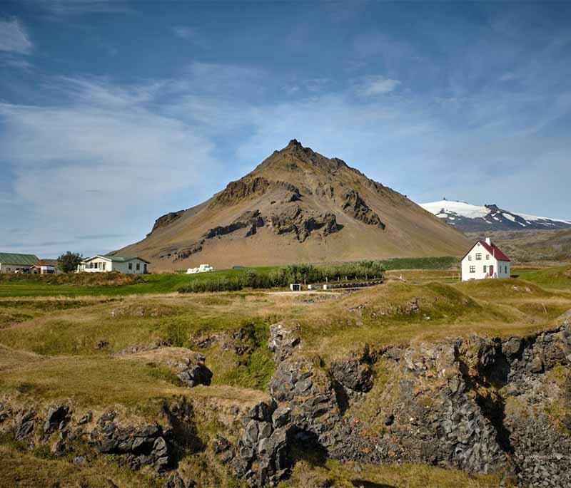 Arnarstapi, a charming coastal village on the Snaefellsnes Peninsula, known for its dramatic cliffs and rock formations.