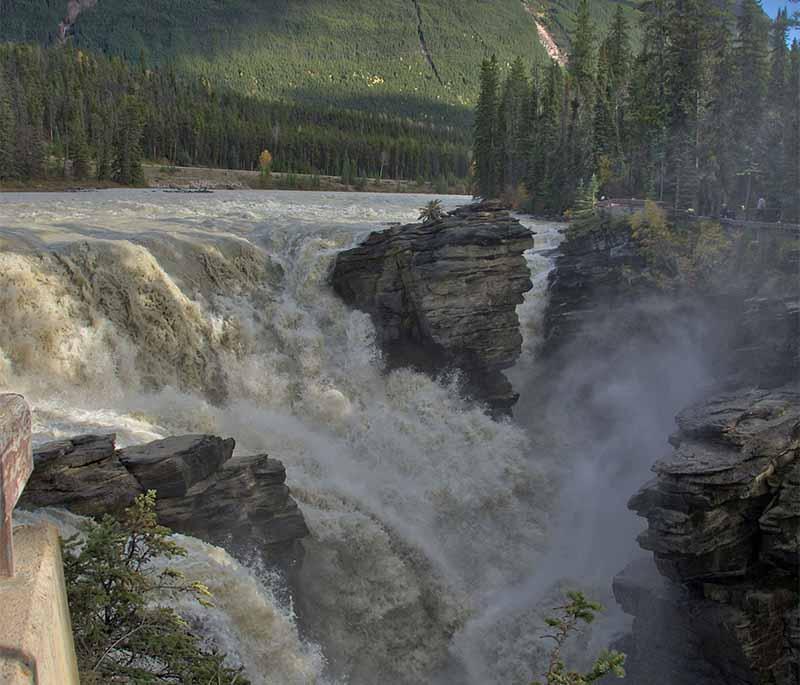 Athabasca Falls in Alberta is known for its powerful falls and scenic trails in Jasper National Park.