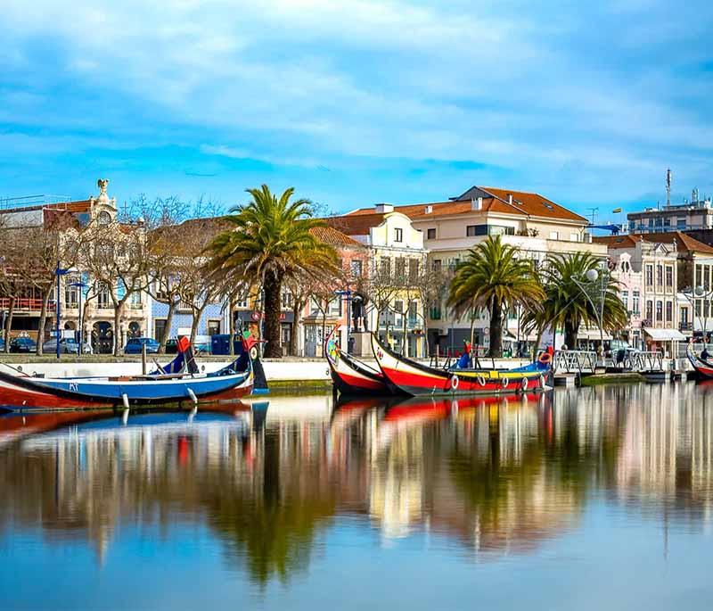 Aveiro - Known as the Venice of Portugal, famous for canals, colorful boats, and Art Nouveau architecture.