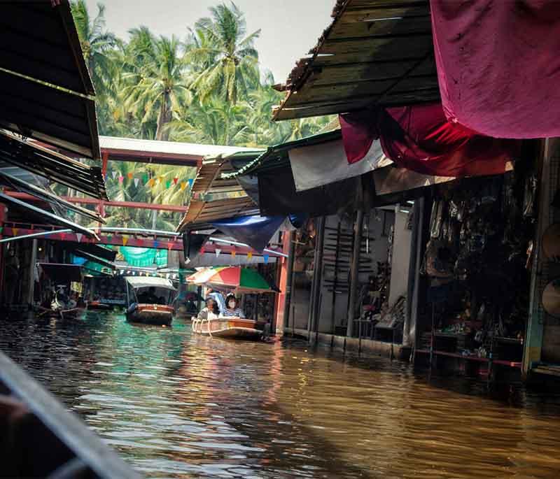 Ayutthaya Floating Market, Ayutthaya - A market offering traditional goods and foods, with vendors selling from boats.
