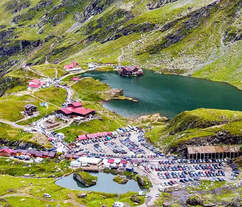 Bâlea Lake - A stunning glacial lake accessible by cable car, located along the Transfăgărășan Highway.