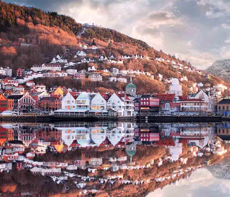 Bergen - A picturesque city surrounded by mountains and fjords, famous for its historic Bryggen wharf.