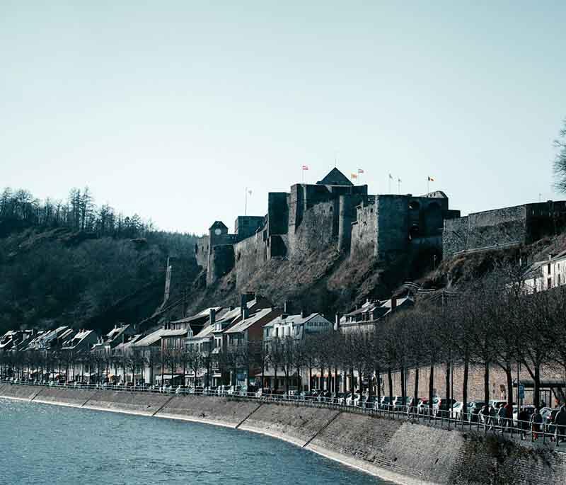 Bouillon Castle, a medieval fortress with dramatic views of Semois River, offering insights into the region's feudal past.