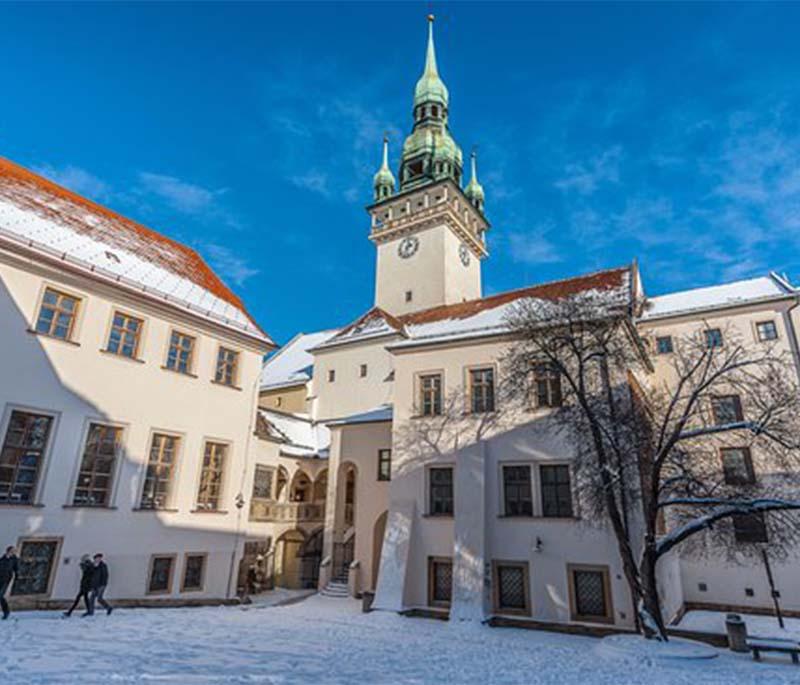 Brno Old Town Hall, featuring a mix of Gothic and Renaissance architecture and the famous Brno dragon sculpture.