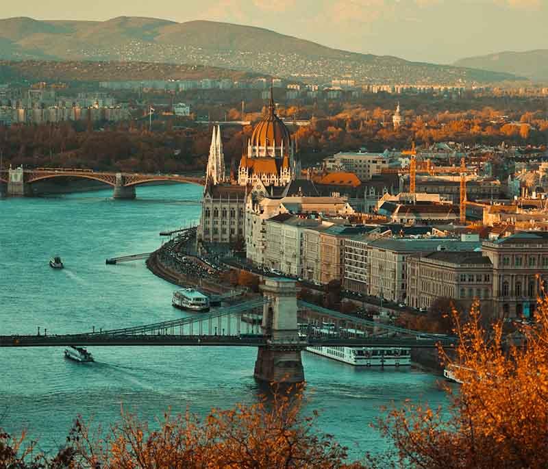Budapest - Danube Promenade, a walkway along the Danube River offering views of Buda Castle and Parliament Building.
