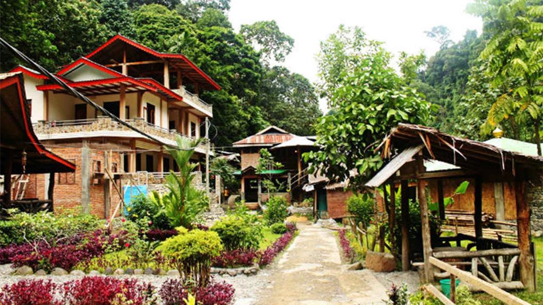 Bukit Lawang: Village in North Sumatra, known for its orangutan rehabilitation center and jungle treks.