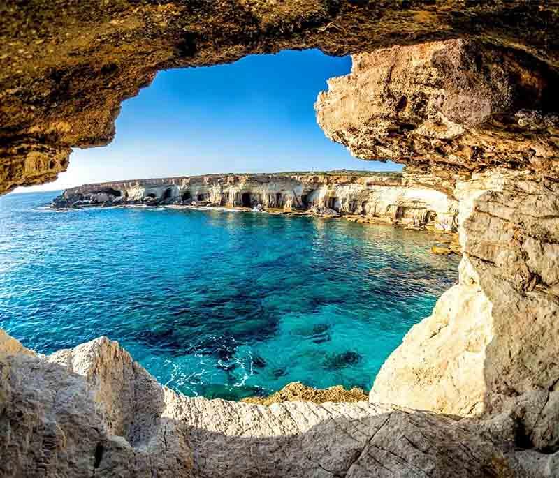 Cape Greco National Forest Park, known for dramatic cliffs, sea caves, and clear waters, ideal for hiking and diving.
