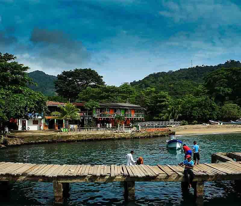 Capurganá, a remote coastal village offering stunning beaches, crystal-clear waters, and access to lush tropical rainforests.