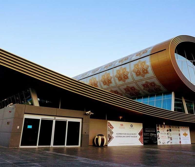 Carpet Museum, Baku, featuring a building shaped like a rolled carpet, housing extensive collections of Azerbaijani carpets.