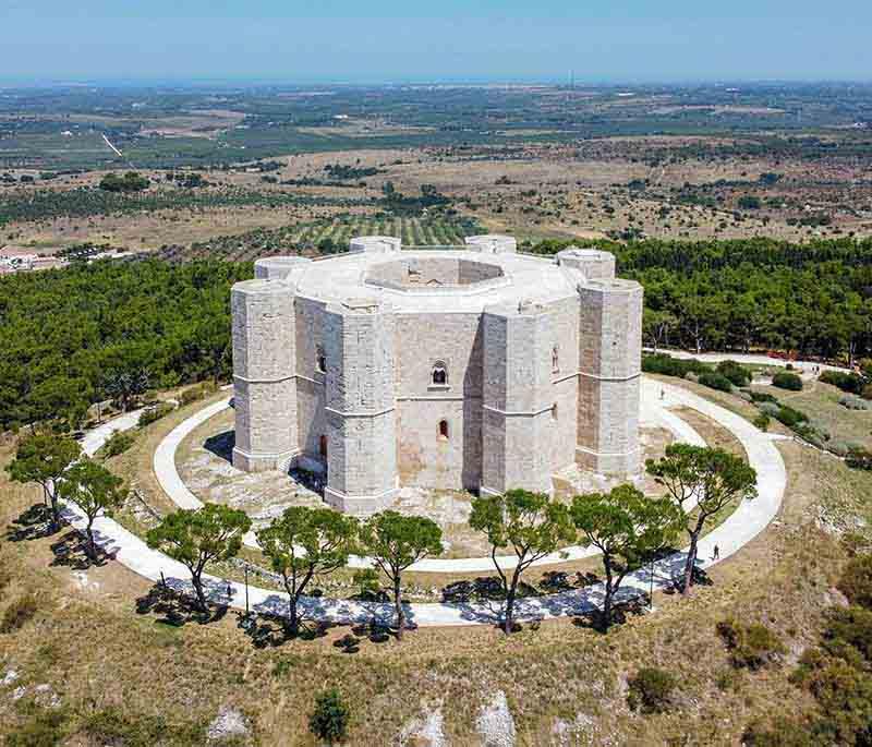 Castel del Monte, Apulia, a unique 13th-century castle known for its octagonal shape and blend of architectural styles.