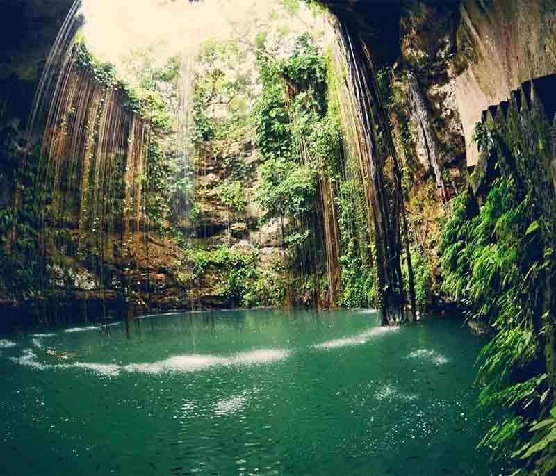 Cenote Ik Kil, Yucatan - Popular cenote near Chichen Itza, known for vine-draped openings, deep swimming hole.