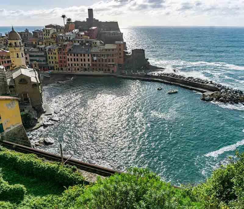 Cinque Terre, Liguria, a region of five coastal villages known for colorful houses, steep terraces, and hiking trails.