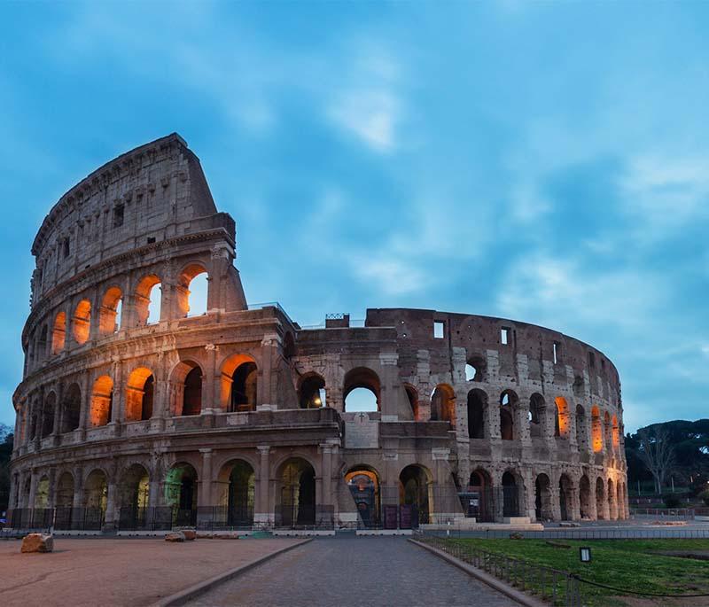 Colosseum, Rome, an ancient amphitheater known for its size and gladiatorial contests, one of Rome's iconic landmarks.