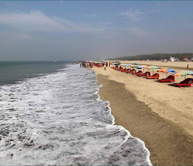 Cox's Bazar Beach, featuring the world's longest natural sandy sea beach, a popular tourist destination.
