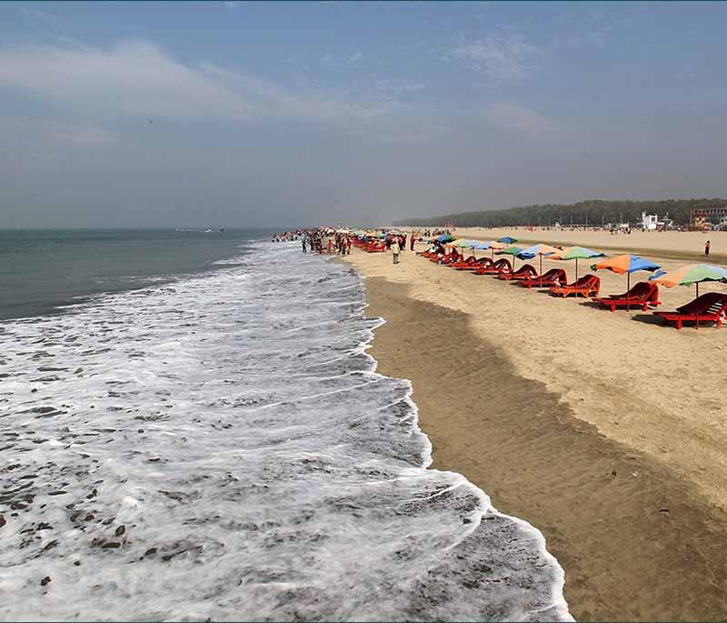 Cox's Bazar Beach, featuring the world's longest natural sandy sea beach, a popular tourist destination.