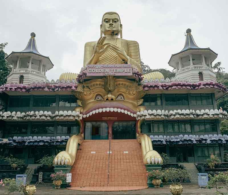 Dambulla Cave Temple - UNESCO site, ancient Buddhist caves with stunning frescoes, murals, and statues.