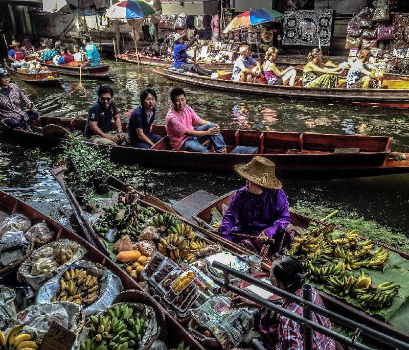Damnoen Saduak Floating Market, Ratchaburi - A famous floating market known for its vibrant atmosphere and traditional goods.