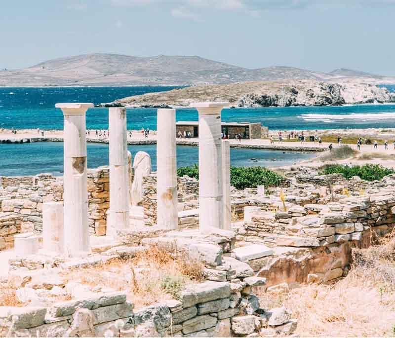 Delos, an uninhabited island near Mykonos, known for its extensive archaeological ruins, including temples and theaters.