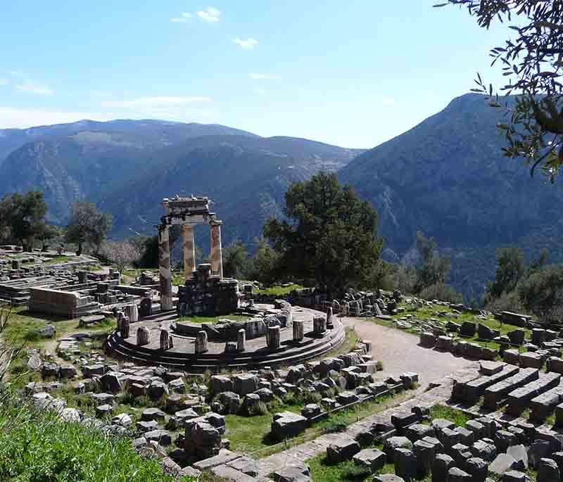 Delphi, an ancient sanctuary and seat of the oracle of Apollo, with archaeological ruins and panoramic views.