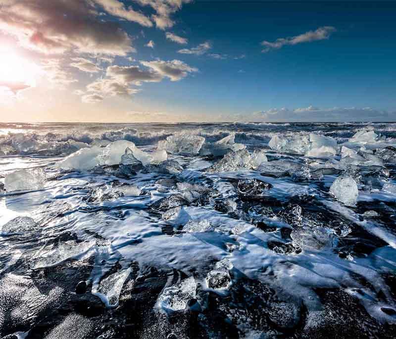 Diamond Beach, a black sand beach near Jokulsarlon Glacier Lagoon, known for its sparkling ice chunks that resemble diamonds.