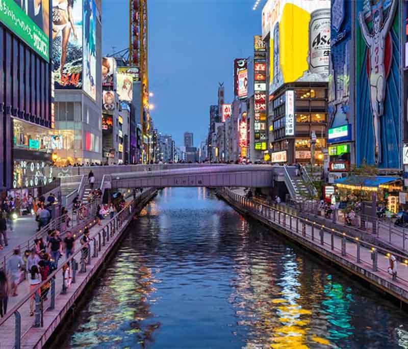 Dotonbori, Osaka: Experience Dotonbori, Osaka, a lively area famous for neon lights, street food, and the iconic Glico sign.