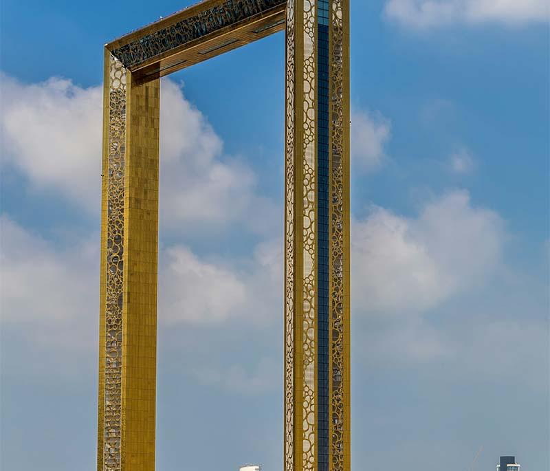 Dubai Frame, Dubai - An architectural landmark offering panoramic views of old and new Dubai from its glass bridge.