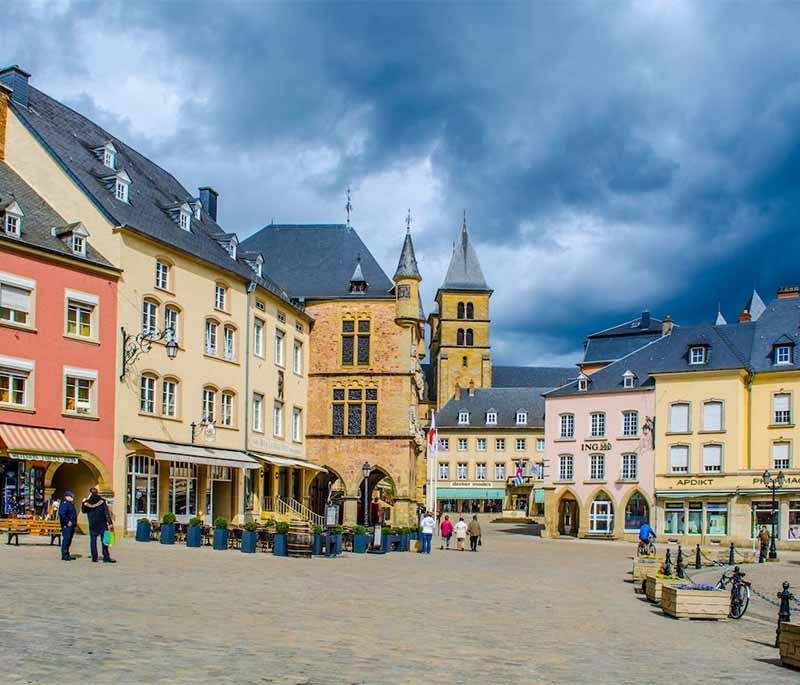 Echternach, the oldest town in Luxembourg, known for its beautiful abbey, historic buildings, and lively cultural events.