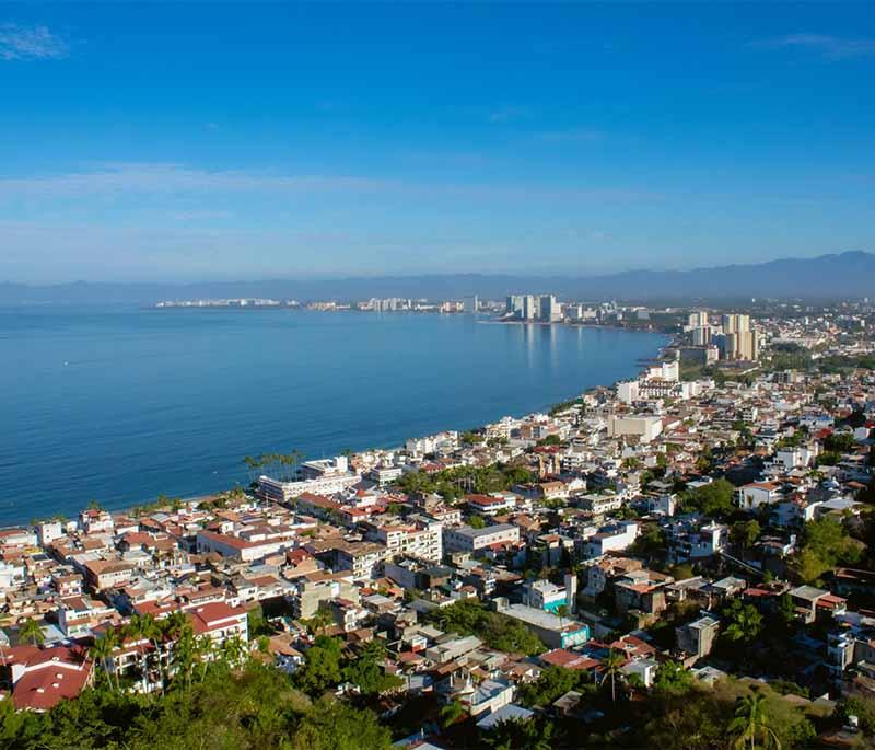 El Malecon, Puerto Vallarta: Lively waterfront promenade with sculptures, shops, and restaurants, perfect for a scenic stroll