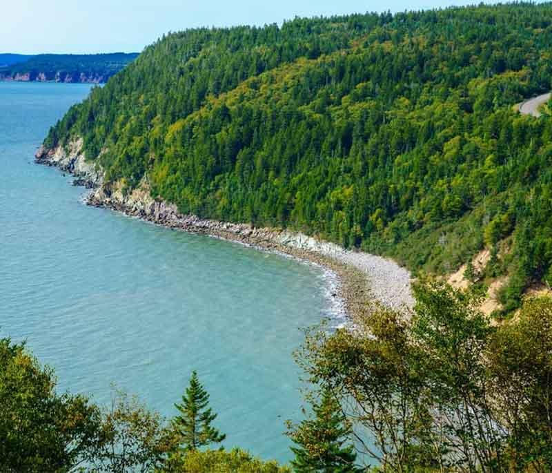 Fundy National Park in New Brunswick offers dense forests, deep river valleys, and a rugged coastline.