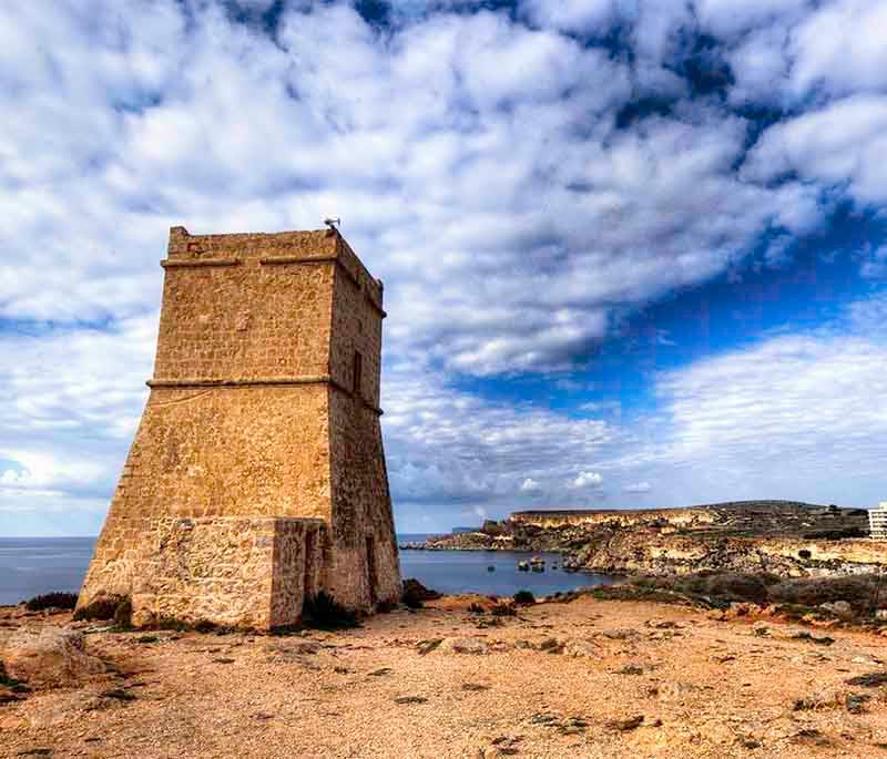Għajn Tuffieħa Tower, a coastal watchtower, serves as a reminder of Malta’s historical military architecture.