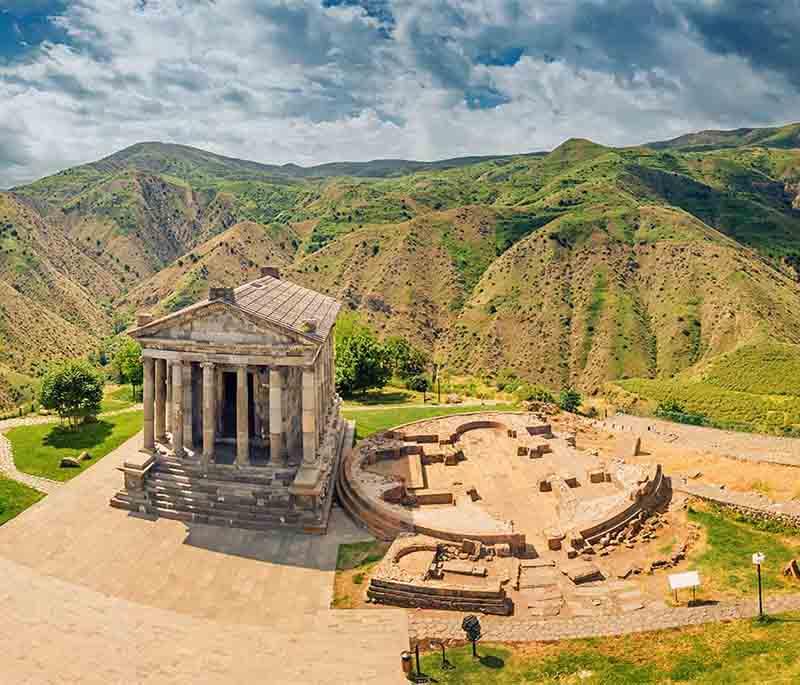 Garni Temple, depicting the only standing Greco-Roman colonnaded building in Armenia surrounded by mountain scenery.