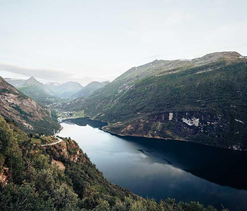 Geirangerfjord - A UNESCO World Heritage site known for its dramatic scenery, waterfalls, and steep cliffs.