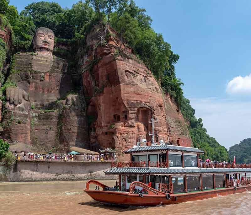Giant Buddha of Leshan, Sichuan, is the largest stone Buddha in the world, carved out of a cliff face.