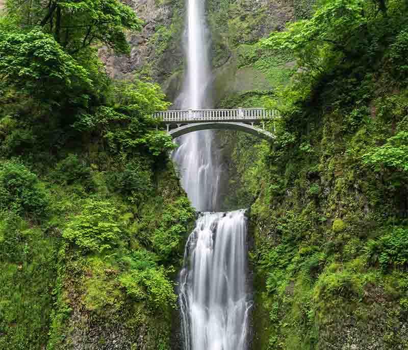 Glencar Waterfall, County Leitrim, a picturesque waterfall surrounded by lush greenery, made famous by W.B. Yeats' poetry.