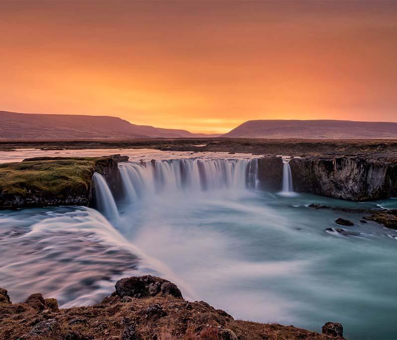 Godafoss Waterfall, known as the Waterfall of the Gods, featuring a stunning horseshoe-shaped cascade.