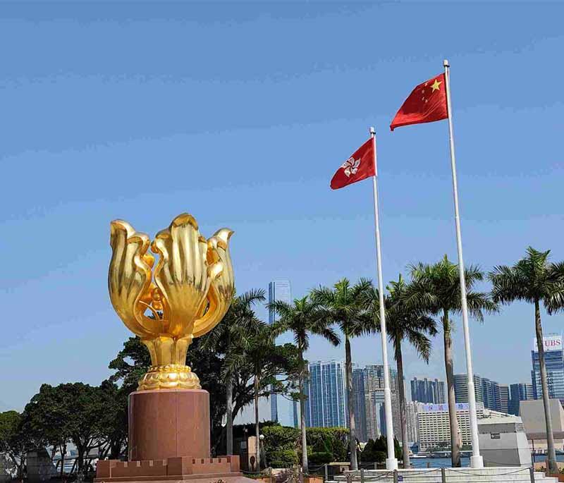 Golden Bauhinia Square in Hong Kong, a landmark with a golden statue of the Hong Kong emblem and scenic waterfront views.