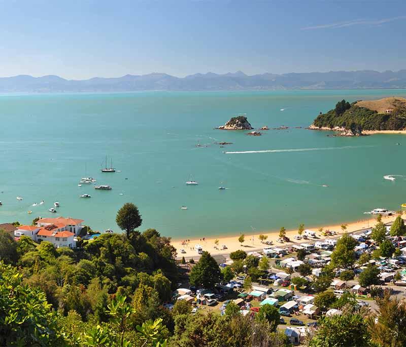 Golden Bay, a beautiful sandy beach, is perfect for sunbathing, swimming, and enjoying stunning sunsets.