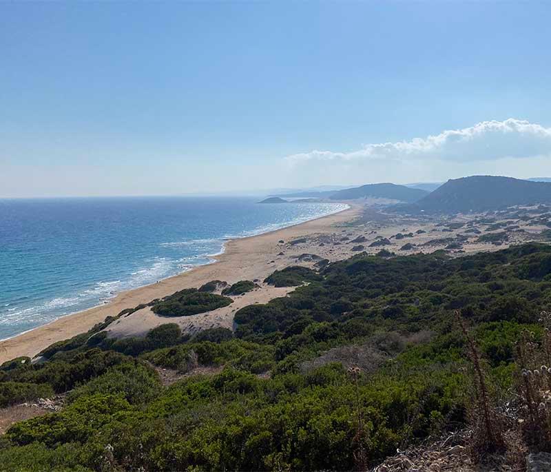 Golden Beach (Northern Cyprus), a pristine beach known for its golden sands and crystal-clear waters, ideal for relaxation.