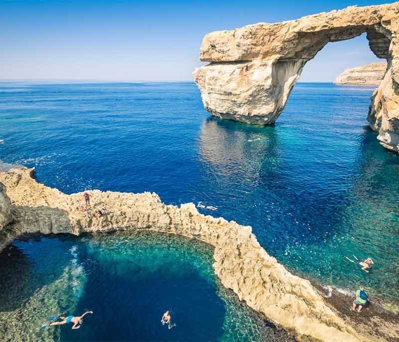 Gozo, Malta's sister island, boasts distinct attractions including rustic landscapes and quiet towns.