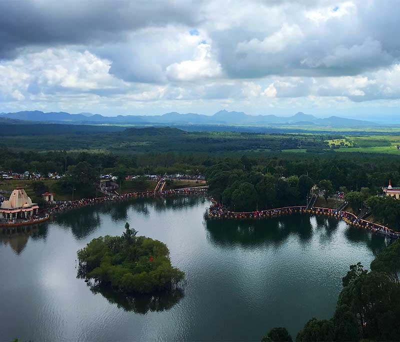 Grand Bassin - Another sacred lake, known as Ganga Talao, surrounded by Hindu temples and statues, tranquil atmosphere.