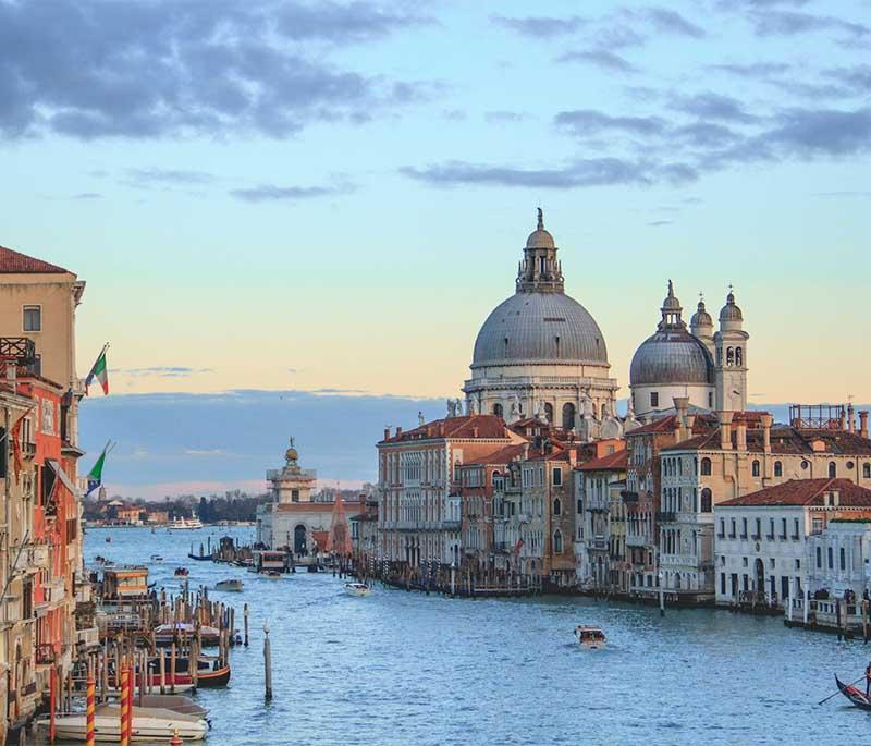 Grand Canal, Venice, the main waterway in Venice, lined with historic buildings and traversed by gondolas and water buses.