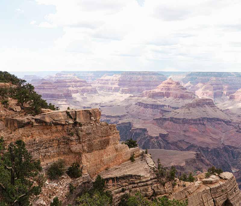 Grand Canyon, Arizona: Breathtaking natural wonder known for its immense size, stunning views, and outdoor activities.