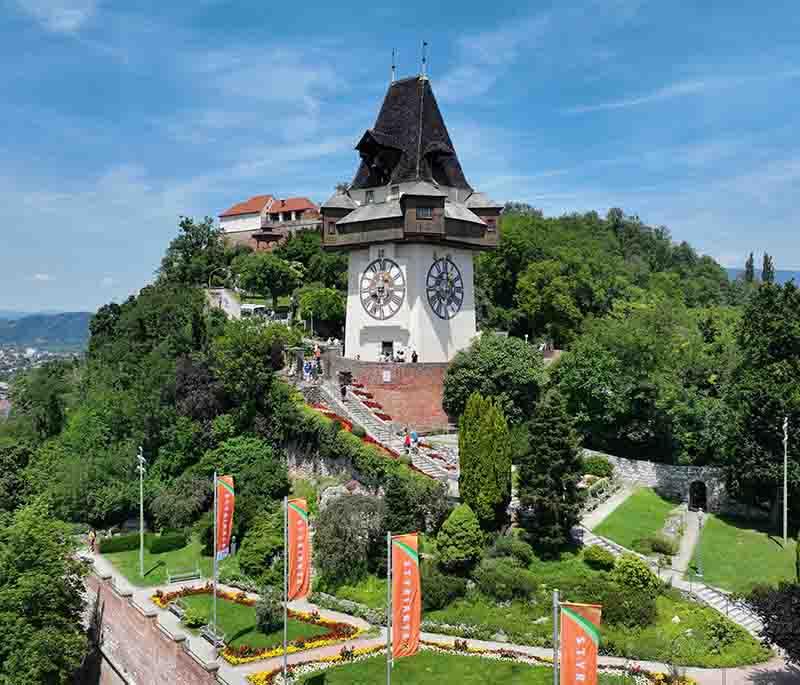 Graz Clock Tower, a historic symbol in Graz, provides panoramic views of the city from its prominent hilltop location.