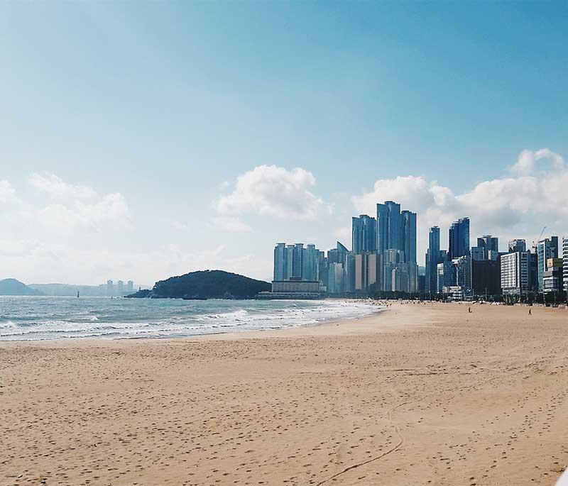 Haeundae Beach, Busan - One of South Korea's most famous beaches, known for sandy shores, festivals, and vibrant atmosphere.