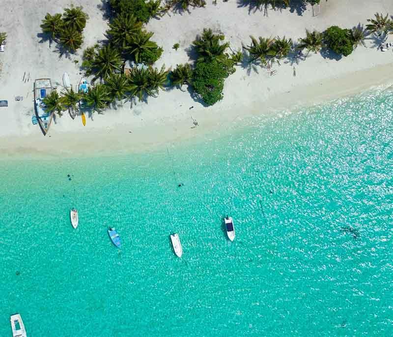 Hanimaadhoo: Idyllic Hanimaadhoo Island, Maldives, with pristine beaches, waters, and greenery, ideal for a serene escape.